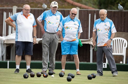 A group of men on the bowls green