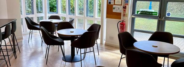Tables and chairs in the cafe area