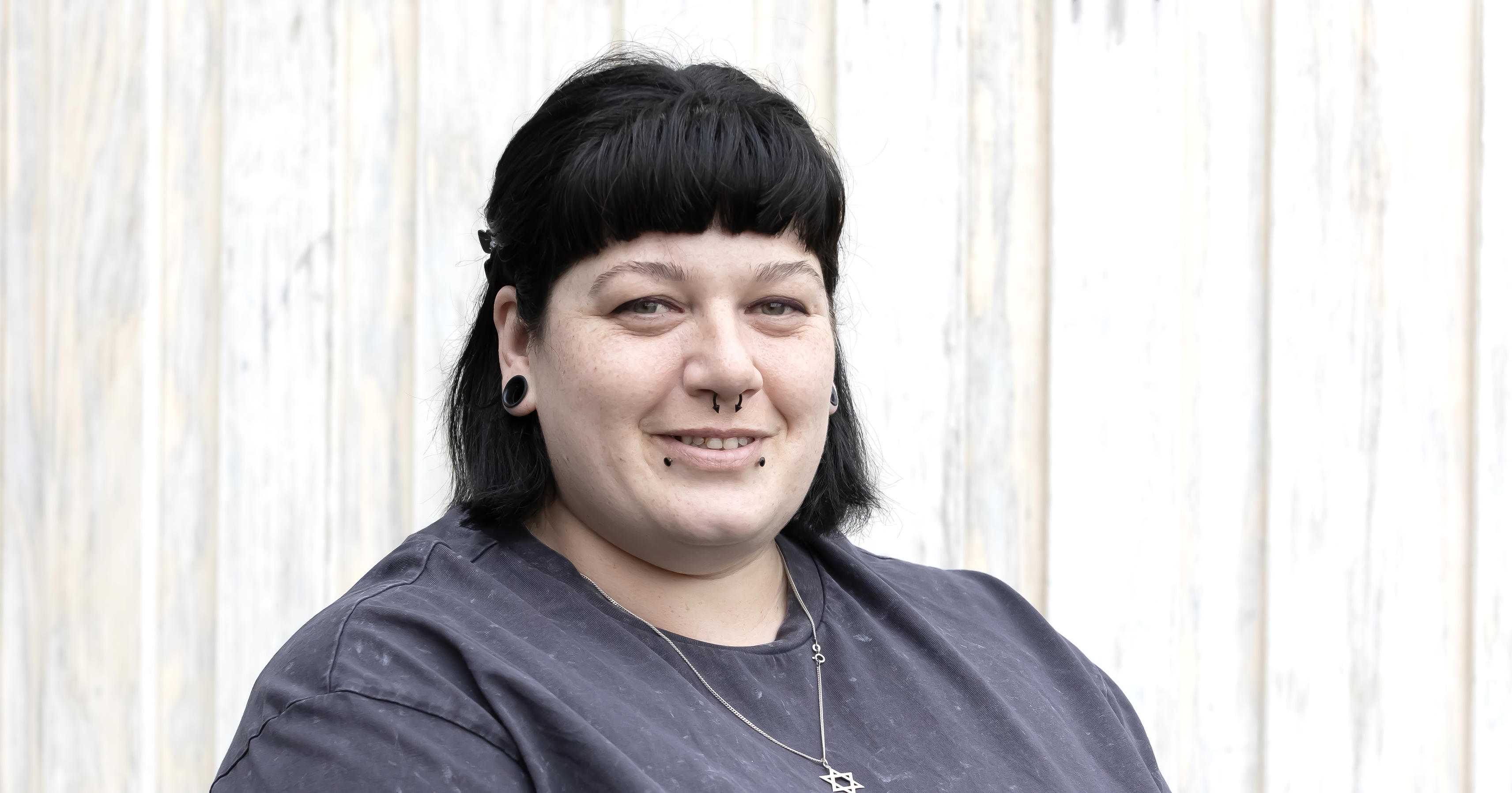 Magenta Lavey is facing the camera and smiling