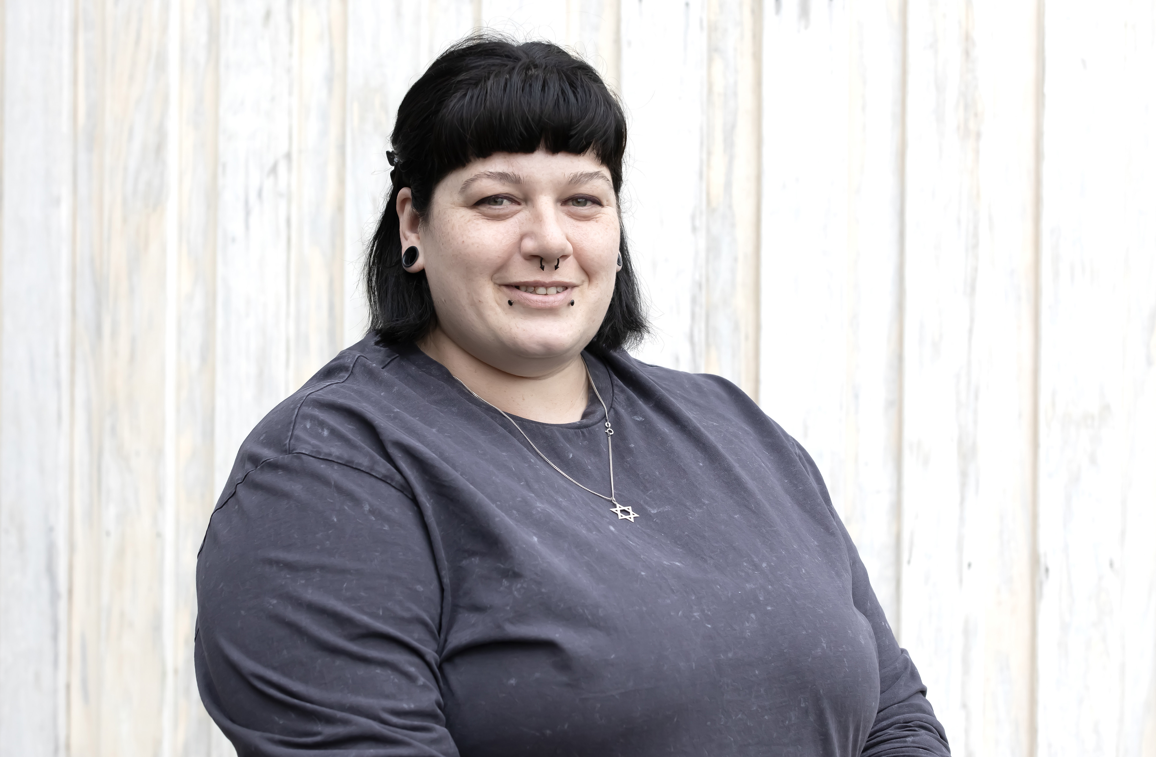 Magenta Lavey is facing the camera and smiling