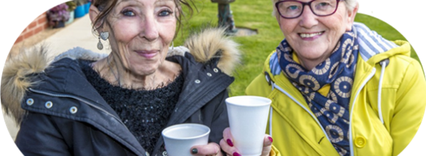 Eastlight residents drink coffee outside