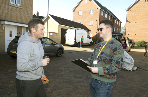 A resident and staff member talking