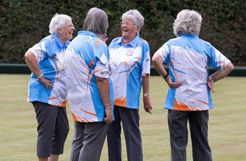 A group of Bowls ladies chatting and laughing