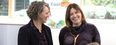 Chief Executive, Emma Palmer - and Executive Director, Jo Barrett - smiling in conversation