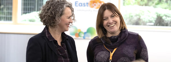 Chief Executive, Emma Palmer - and Executive Director, Jo Barrett - smiling in conversation