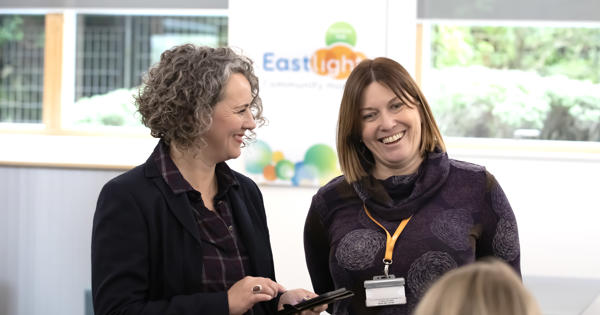 Chief Executive, Emma Palmer - and Executive Director, Jo Barrett - smiling in conversation