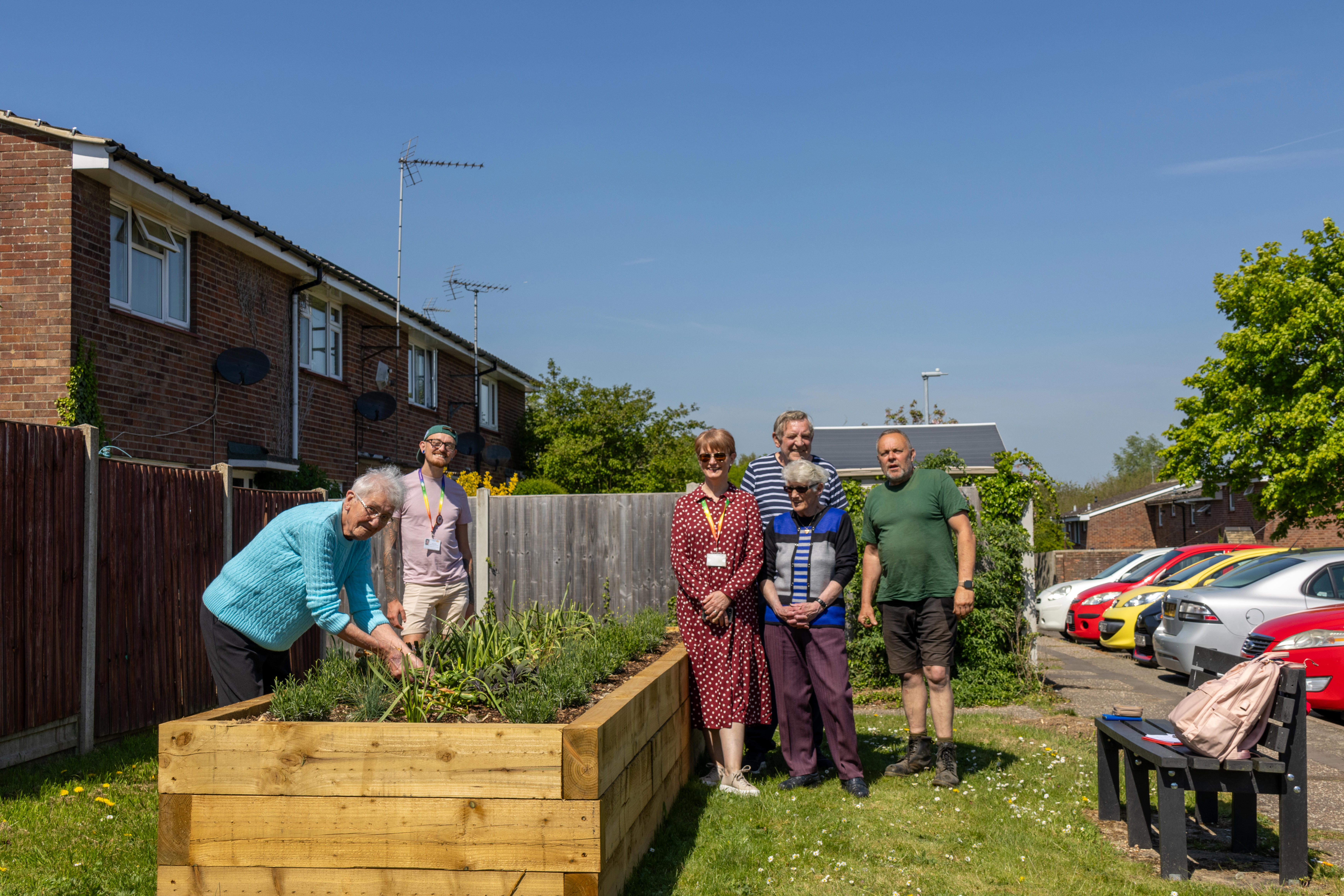 Eastlight's Bobby and Jo are stood with ERG Witham members who have installed a new flowerbed in their community.