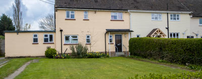 A semi-detached house painted a pale orange.