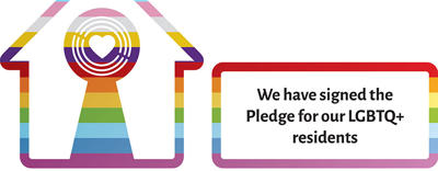 Logo of LGBTQ+ Housing Pioneer+ featuring a house with rainbow colours and text  stating, "We are going further alongside our LGBTQ+ residents.