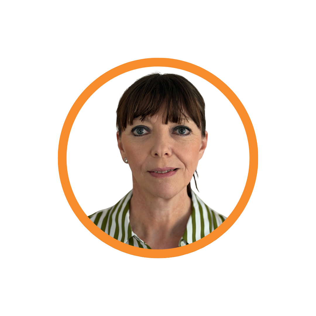 Claire Morris is wearing a white and green striped shirt. She is smiling. Her hair is tied back with a fringe across her forehead.