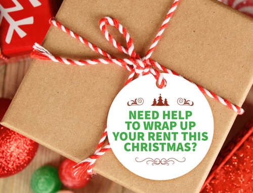 A wrapped parcel tied with red and white string. The label says "Need help to wrap up your rent this christmas?"
